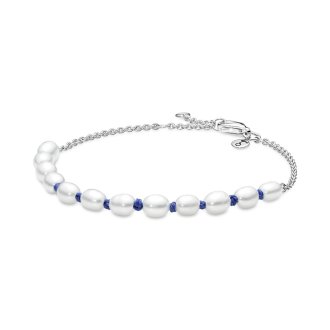 Sterling silver bracelet with white treated freshwater cultured pearl and blue cord